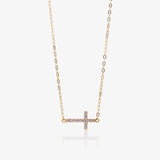Zirconia cross necklace.